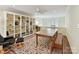 Large bonus room with built-in shelving, wood flooring and large windows at 6645 Gaywind Dr, Charlotte, NC 28226