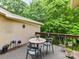 Outdoor deck featuring a table with seating and lush green surroundings at 6645 Gaywind Dr, Charlotte, NC 28226