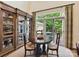 Dining area showcasing built-in shelving with a seamless transition to an outdoor deck at 6645 Gaywind Dr, Charlotte, NC 28226
