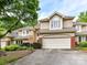 The front exterior features a two-car garage, manicured landscaping, and a well-maintained facade for excellent curb appeal at 6645 Gaywind Dr, Charlotte, NC 28226