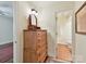 Hallway dresser and mirror with a view into the water closet at 6645 Gaywind Dr, Charlotte, NC 28226