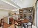 Kitchen featuring an island, dining area, and seamless transition to an outdoor deck at 6645 Gaywind Dr, Charlotte, NC 28226