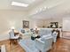 Comfortable living room with skylights, hardwood floors, and stylish furnishings at 6645 Gaywind Dr, Charlotte, NC 28226