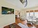Bright living room with hardwood floors, a ceiling fan, and views of the outdoors at 6645 Gaywind Dr, Charlotte, NC 28226