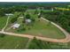 Expansive land featuring a home, a barn, and a pond, surrounded by lush greenery and trees at 6813 Rebel Rd, Marshville, NC 28103