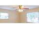 This well-lit bedroom features fresh paint, a ceiling fan and natural light from the two large windows at 6813 Rebel Rd, Marshville, NC 28103