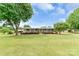 Attractive home featuring a covered front porch and a sprawling green lawn with mature trees at 6813 Rebel Rd, Marshville, NC 28103