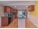 Well-equipped kitchen featuring granite countertops, stainless steel appliances, and hardwood floors at 6813 Rebel Rd, Marshville, NC 28103