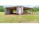 A small storage building provides convenient backyard storage for equipment and yard maintenance at 6813 Rebel Rd, Marshville, NC 28103