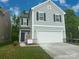 Beautiful two-story home featuring a two-car garage and a manicured lawn at 756 Gondola Ct # 127, Salisbury, NC 28144