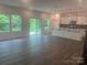 Spacious living room with hardwood floors that open to a bright kitchen at 756 Gondola Ct # 127, Salisbury, NC 28144