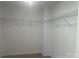 Walk-in closet with wire shelving all around and neutral carpet at 756 Gondola Ct # 127, Salisbury, NC 28144