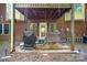 Back patio with swing and gas grill provides space for outdoor relaxation and entertaining at 8300 Loma Linda Ln, Waxhaw, NC 28173