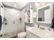 Modern bathroom with walk-in shower, tiled walls, and marble countertop at 8300 Loma Linda Ln, Waxhaw, NC 28173