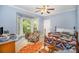 Bedroom with a bay window and ceiling fan offers lots of natural light at 8300 Loma Linda Ln, Waxhaw, NC 28173