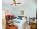 Bright bedroom with a queen-size bed and a ceiling fan, offering a comfortable and well-lit living space at 8300 Loma Linda Ln, Waxhaw, NC 28173
