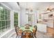 Bright breakfast nook with a table that seats four, light fixture, and kitchen access at 8300 Loma Linda Ln, Waxhaw, NC 28173