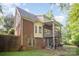 Brick home with a covered porch and deck, perfect for outdoor entertaining at 8300 Loma Linda Ln, Waxhaw, NC 28173