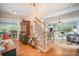 Elegant foyer with hardwood floors, staircase, and an open view to the living and dining areas at 8300 Loma Linda Ln, Waxhaw, NC 28173