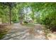 Charming home nestled among mature trees and landscaping with a circular driveway at 8300 Loma Linda Ln, Waxhaw, NC 28173