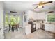 Spacious kitchen features tiled flooring, breakfast nook, white cabinets, and stainless steel appliances at 8300 Loma Linda Ln, Waxhaw, NC 28173