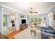 Cozy living room featuring natural light, comfortable seating, and an open flow to the kitchen at 8300 Loma Linda Ln, Waxhaw, NC 28173