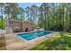 Backyard with a large pool, patio area with seating, surrounded by mature trees and green lawn at 836 Meadowlark Dr, Rock Hill, SC 29732