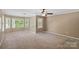 Bright, spacious bedroom with a ceiling fan, neutral carpet, and a bay window providing ample light at 836 Meadowlark Dr, Rock Hill, SC 29732
