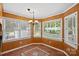 Cozy breakfast nook featuring three windows, decorative tile floors, and a charming chandelier at 836 Meadowlark Dr, Rock Hill, SC 29732