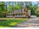 Inviting two-story home with a full front porch, manicured lawn, mature shade trees, and a paved driveway at 836 Meadowlark Dr, Rock Hill, SC 29732