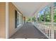 Long covered front porch offering a relaxing view of the verdant surroundings at 836 Meadowlark Dr, Rock Hill, SC 29732