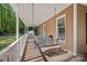 A charming front porch featuring a porch swing, offering a relaxing view of the verdant surroundings at 836 Meadowlark Dr, Rock Hill, SC 29732