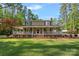 Charming two-story home with a covered porch, brick stairs and walkway, and a large landscaped front yard at 836 Meadowlark Dr, Rock Hill, SC 29732