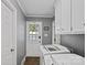 This mudroom/laundry room has a convenient backdoor and front loading washer at 836 Meadowlark Dr, Rock Hill, SC 29732