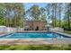 Backyard with a large in-ground pool, patio area, and white fence at 836 Meadowlark Dr, Rock Hill, SC 29732