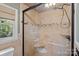 Updated shower with glass door, attractive tile work and tiled shower seat at 836 Meadowlark Dr, Rock Hill, SC 29732