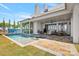 Luxury backyard with a pool, spa, outdoor patio, and a view of the lake at 8397 Ranger Island Marina Rd, Denver, NC 28037
