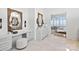 Elegant bathroom featuring a vanity with a makeup area, modern mirrors, and serene lake views at 8397 Ranger Island Marina Rd, Denver, NC 28037
