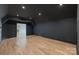 Spacious bonus room featuring hardwood floors, recessed lighting, and dark-painted walls at 8397 Ranger Island Marina Rd, Denver, NC 28037