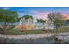 Expansive backyard with lake views featuring a waterfront home with landscaped lawn at 8397 Ranger Island Marina Rd, Denver, NC 28037