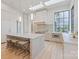 Modern kitchen island with seating, marble counters and custom cabinetry at 8397 Ranger Island Marina Rd, Denver, NC 28037