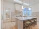 Kitchen island with bar stools, marble countertop and a view of the lake at 8397 Ranger Island Marina Rd, Denver, NC 28037