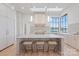 Well-lit kitchen island with pendant lights and a marble countertop at 8397 Ranger Island Marina Rd, Denver, NC 28037