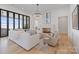 Bright living room with modern fireplace and lake views at 8397 Ranger Island Marina Rd, Denver, NC 28037