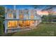 Stately home featuring a pool, covered patio, well-manicured lawn, and lake access at 8397 Ranger Island Marina Rd, Denver, NC 28037