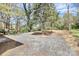 Spacious, landscaped backyard with trees and gravel at 908 W Airline Ave, Gastonia, NC 28052