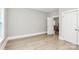 Well-lit bedroom featuring wood flooring and neutral wall colors at 908 W Airline Ave, Gastonia, NC 28052
