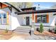 Inviting front porch with gray steps, dark pillars, and orange address numbers at 908 W Airline Ave, Gastonia, NC 28052