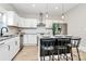 Modern kitchen with stainless steel appliances, granite countertops, and sleek white cabinetry at 908 W Airline Ave, Gastonia, NC 28052