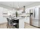 Modern kitchen featuring stainless steel appliances, white cabinets, and a stylish island with seating at 908 W Airline Ave, Gastonia, NC 28052